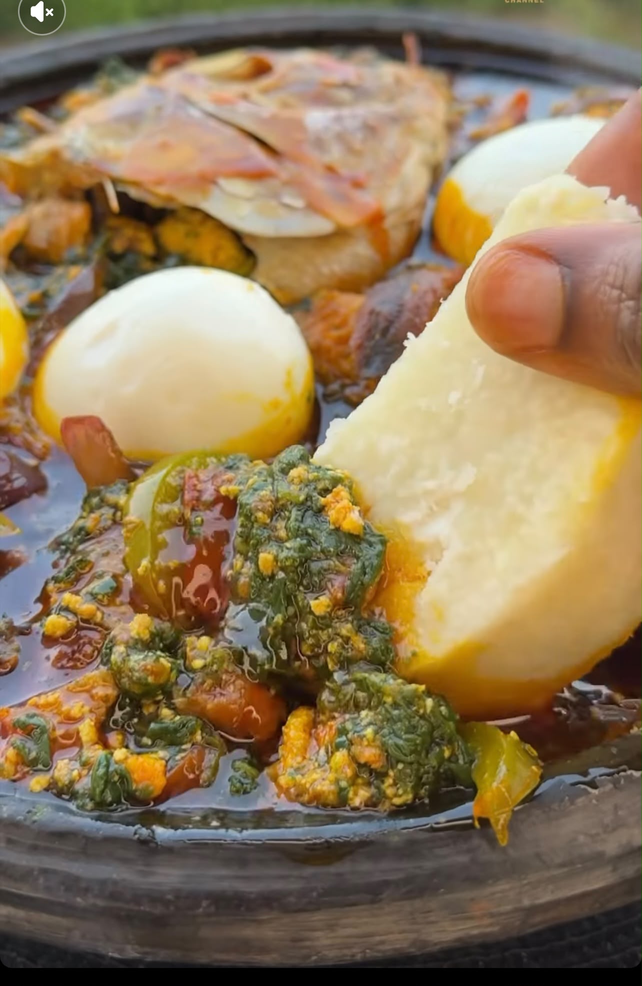 Boiled yam served with kontomire stew, egg and fish