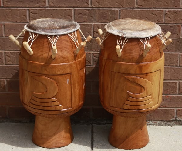 A pair of traditional Ghanaian wooden drums